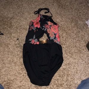 I’m selling a swimsuit one piece that has a flower pattern.